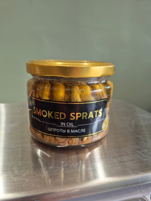 Smoked sprats in oil glass jar