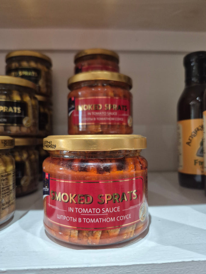 Smoked sprats in tomato sauce glass